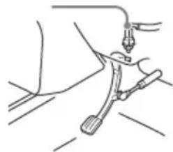 Line drawing of a mechanical device with a clamp and lever (no text or symbols)