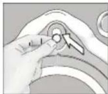 Close-up of a hand adjusting a circular component with a directional arrow (no text or symbols visible)