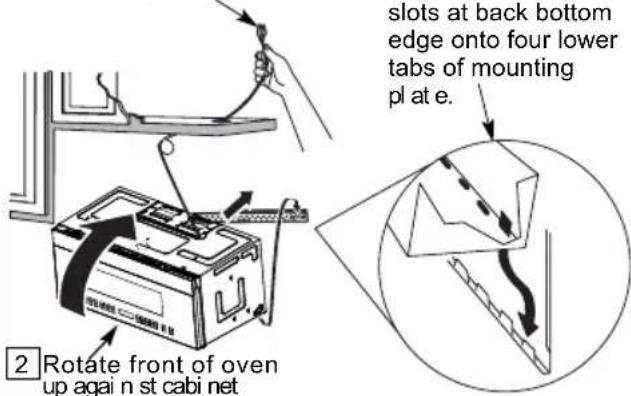 slots at back bottom edge onto four lower tabs of mounting plate. 2 Rotate front of oven up again n st cabi net
