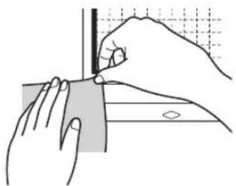 Illustration of hands holding a rectangular object with a ruler and grid background (no text or symbols)