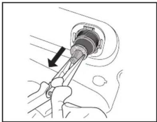 Illustration of a hand using a tool to adjust or install a plug into a socket (no text or symbols visible)