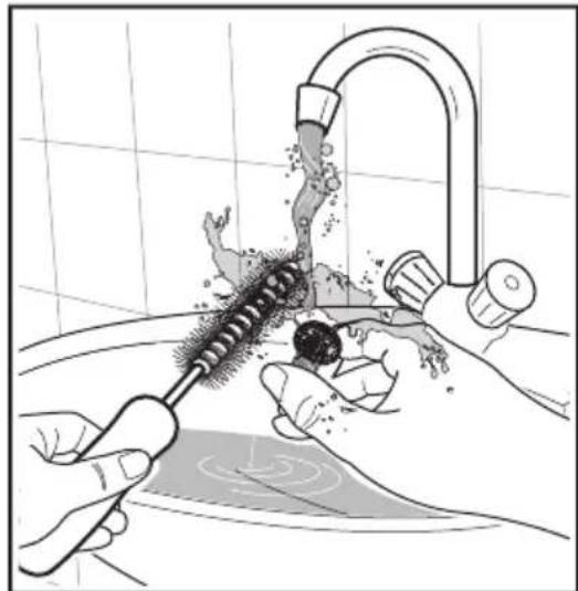 Illustration of hands using a tool to clean or wash a showerhead (no text or symbols).