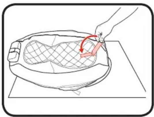 Line drawing of a hand placing a mesh object into a circular component, with a red curved arrow indicating rotation (no text or symbols)