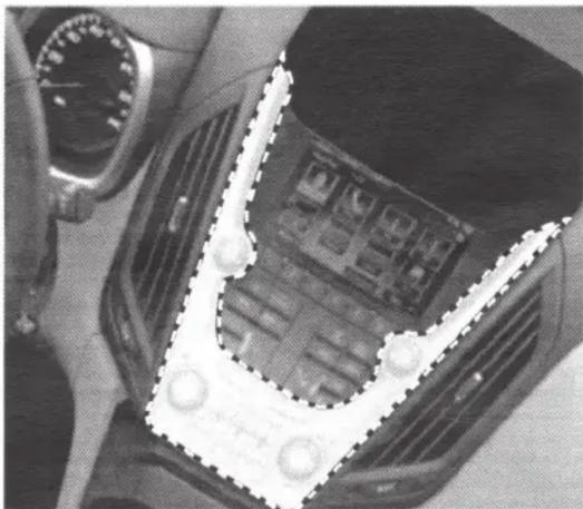 Close-up of a mechanical component with a U-shaped groove and circular features, no visible text or symbols