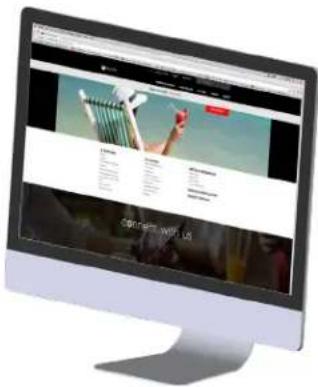 Computer monitor displaying a website with navigation menu and promotional text in the top right corner.