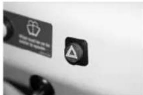 Close-up of a device label with warning symbol and warning text in Chinese