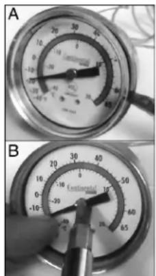 Two analog pressure gauges (A and B) showing different scales and a hand adjusting the dial (no visible text or symbols)