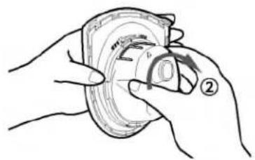 Illustration of hands holding a circular object with a curved arrow indicating rotation (no text or symbols)