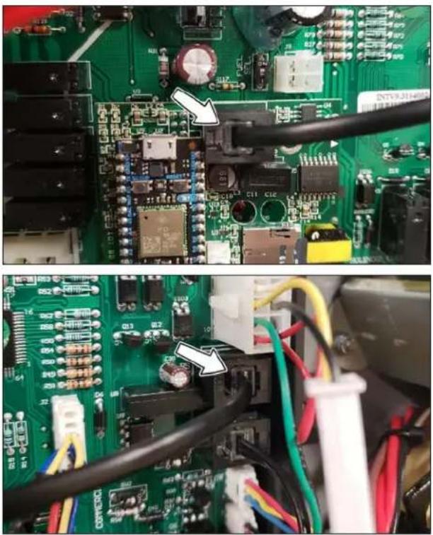 Close-up of a green printed circuit board with electronic components and wiring, no visible text or symbols