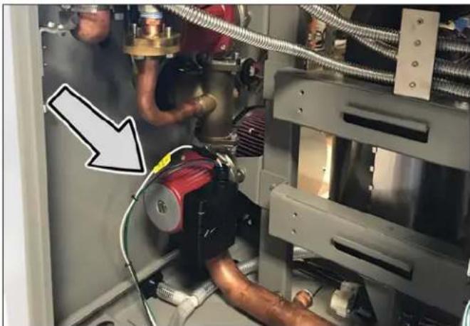 Industrial machine setup with pipes and a red motor, no visible text or symbols