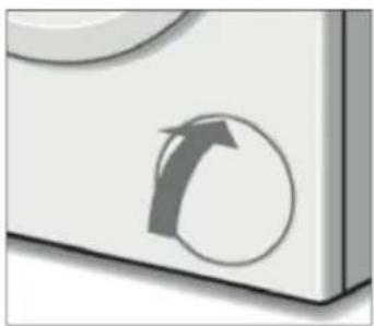 Close-up of a white rectangular object with a circular arrow symbol on its side (no text or symbols present)
