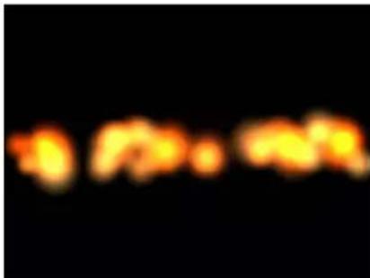 Blurred image with faint, indistinct text on black background, possibly a scanned document or label.