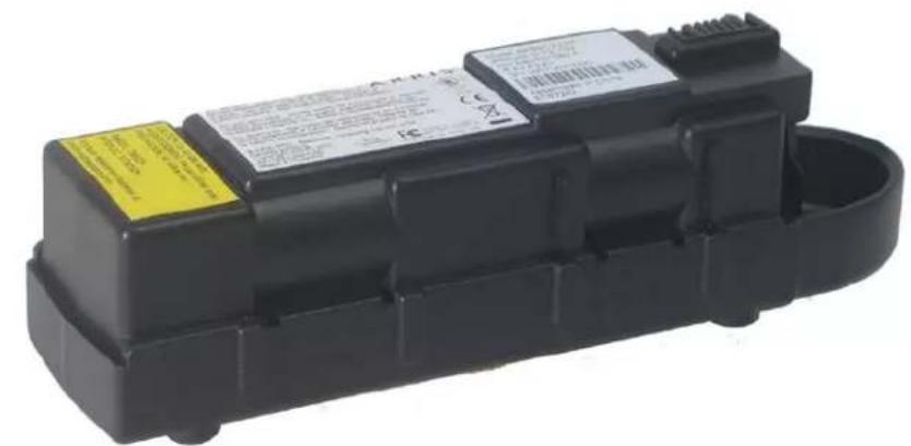 Black battery pack with visible labels and warning text, showing specifications and safety warnings