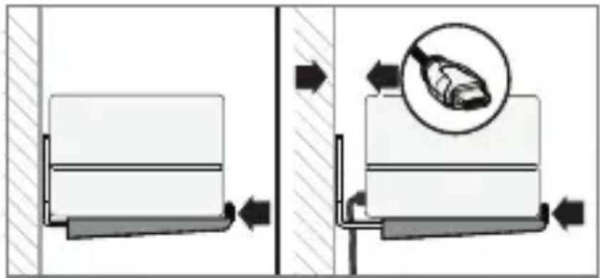 Technical diagram showing fluid flow and component placement with directional arrows and a magnified inset of a device.