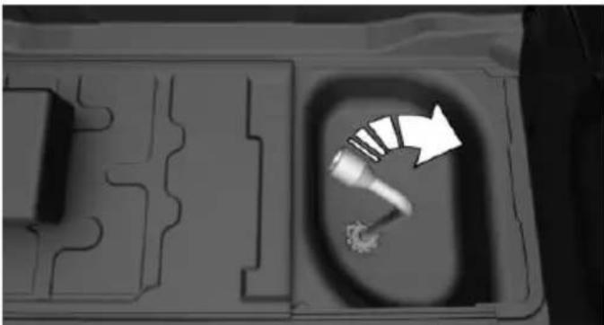 Top-down view of a mechanical component with a highlighted tool and arrow (no text or symbols)