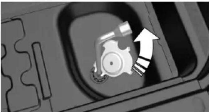 Close-up of a mechanical component with an arrow indicating upward motion (no text or symbols visible)