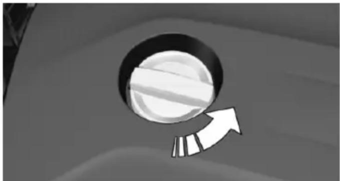 Simple grayscale illustration of a circular object with a curved arrow pointing upward, no text or symbols present.