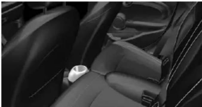 Interior view of a car seatbelt and dashboard compartment (no text or symbols visible)