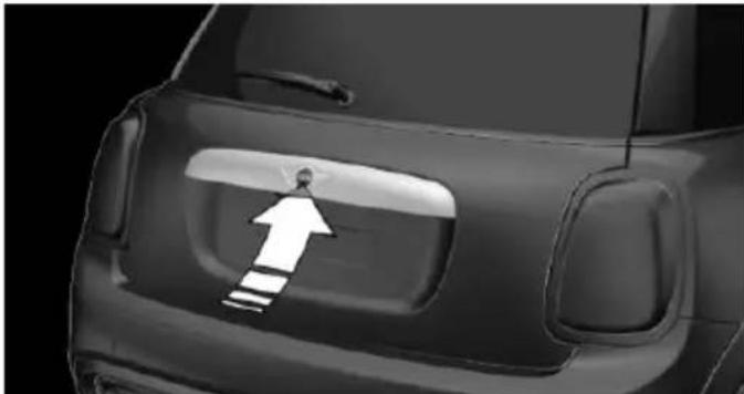 Side view of a car's rear bumper with a white arrow pointing to the side (no text or symbols)