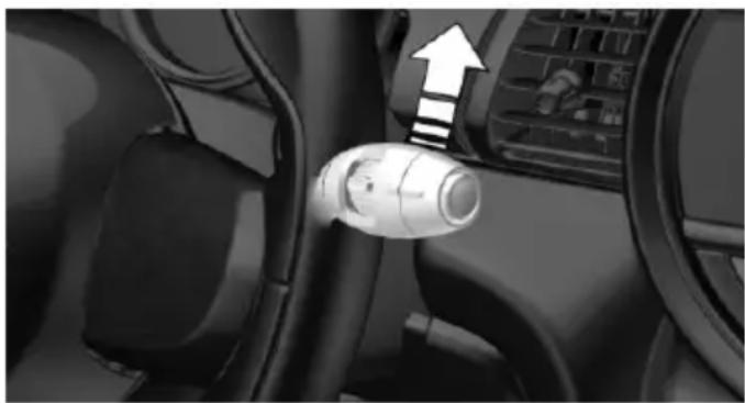 Interior view of a car showing the wheel and seatbelt with an upward arrow indicating direction (no text or symbols)