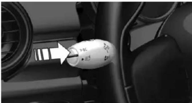 Close-up of a car intake manifold with a white plastic bulb and arrow pointing to the intake (no text or symbols visible)