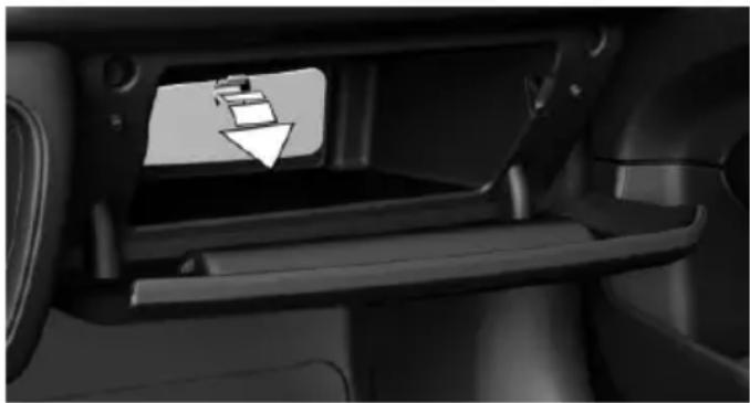 Interior view of a car showing the intake manifold and a white arrow pointing to a component (no text or symbols visible)