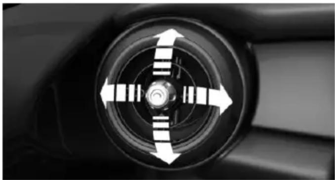 Close-up of a car wheel with directional arrows indicating clockwise motion (no text or symbols)