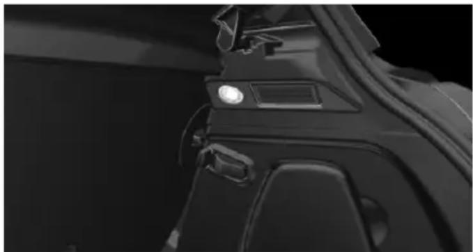 Close-up of a black mechanical component with a light indicator light and a small rectangular opening (no visible text or symbols)