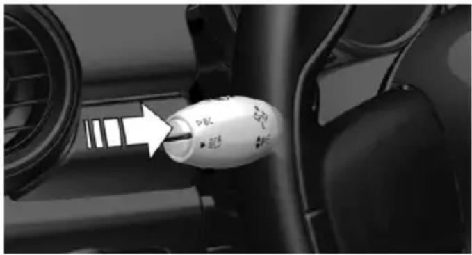 Close-up of a car intake manifold with a white plastic bulb and arrow pointing to the intake (no visible text or symbols)