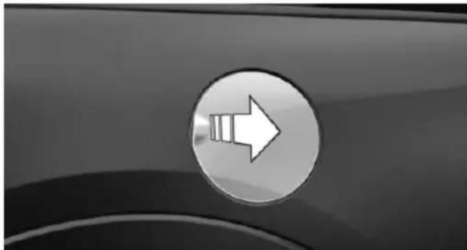 Close-up of a car's side panel with a circular arrow icon (no text or symbols)