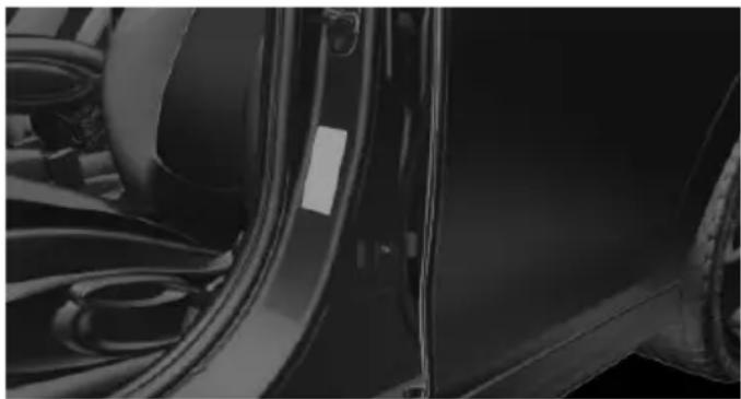 Close-up of a car's side panel showing the front wheel and side door (no visible text or symbols)