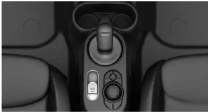 Close-up of a car dashboard with control knob and scroll wheel (no visible text or symbols)