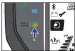 Screenshot of a software interface showing navigation icons and a blue arrow pointing to a green icon, likely from an older application or tool.
