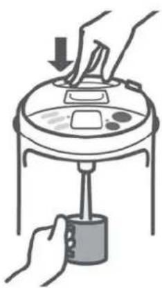 Illustration of hands using a handheld device to press down a lid (no text or symbols visible).