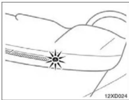 Line drawing of a car's side profile with a sunburst symbol on the nose (no text or labels)