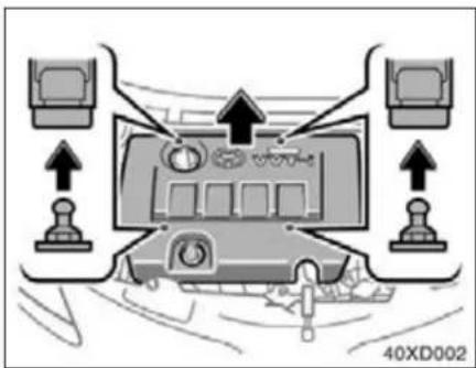 Interior view of a car dashboard with multiple monitors and directional arrows indicating navigation or movement (no text or symbols)