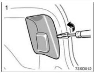 Diagram of a mechanical component with a tool inserted, showing motion lines and no readable text or symbols.