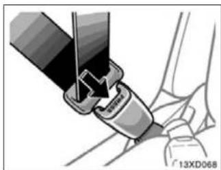 Close-up illustration of a car seatbelt buckle being inserted into a seat (no text or symbols visible)