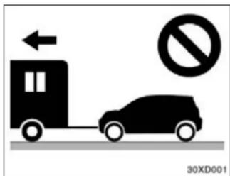 Silhouette of a car being towed by a fuel pump, with no visible text or symbols