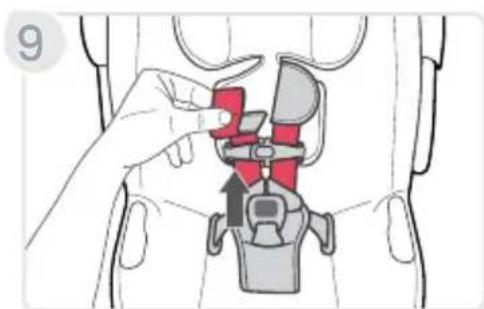 Diagram showing a hand adjusting a seatbelt with red and gray buttons, indicating mechanical or safety instructions.