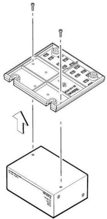 Technical diagram showing a device with labeled components and an arrow indicating assembly or transformation.