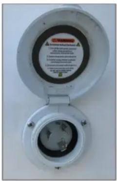 Label on a wall-mounted device showing safety warnings and warning text in Chinese