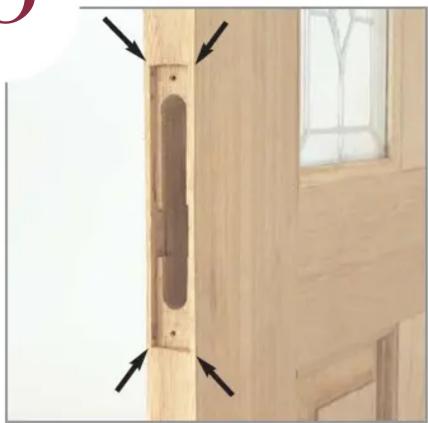 Close-up of a wooden door with a vertical scroll and arrow indicators (no text or symbols)