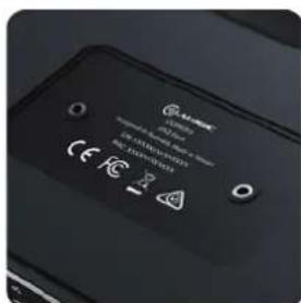 Close-up of a black Lenovo device's rear panel showing certification marks and logos