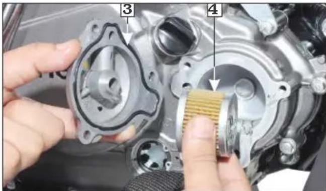 Close-up of mechanical component repair with numbered callouts highlighting parts 3 and 4