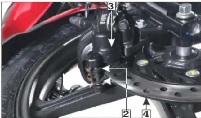 Labeled mechanical assembly diagram showing components like brake calipers, tire, and drivetrain with numbered parts 2, 3, and 4.