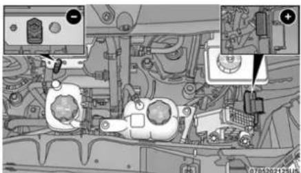 Technical diagram of a vehicle engine bay with labeled components and directional arrows indicating movement or assembly.