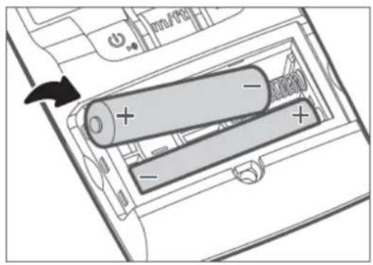 Diagram showing battery charging mechanism with labeled components and polarity indicators