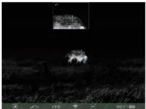 Nighttime outdoor scene with a bright vehicle and a small inset image of a landscape (no visible text or symbols)