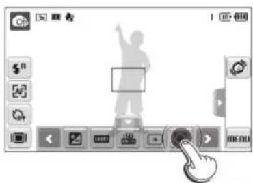 Screenshot of a software interface with a silhouette of a person pointing at a button, surrounded by control buttons and icons.